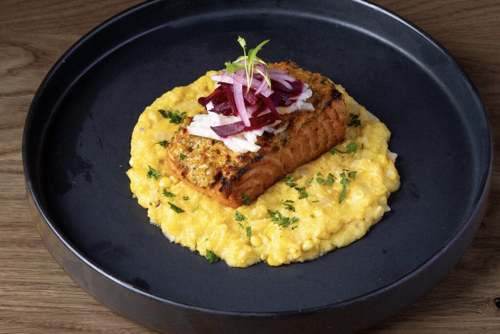 Salmon filet dish at Siete in NYC